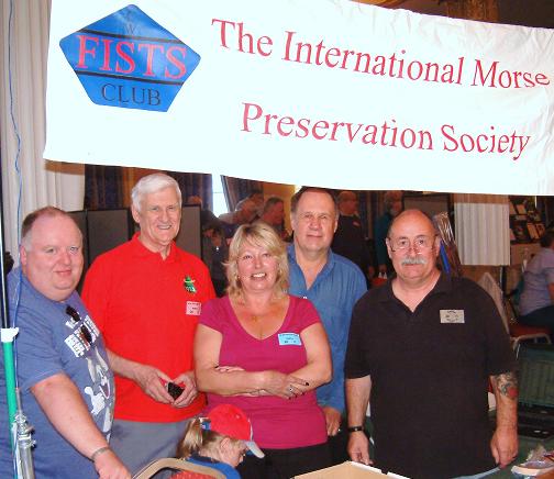 Photograph of Paul M0BMN, Roy G4SSH, Gillian M0BTG, Terry G0PIL and John M0CDL at the FISTS stand, NARSA Norbreck Rally in April 2011