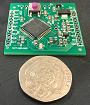 Small photograph of a LASERBEAM digital audio filter module from SOTAbeams with a UK 20 pence coin.