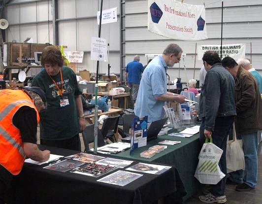 Photograph of Paul M0BMN, Roy G4SSH, Gillian M0BTG, Terry G0PIL and John M0CDL at the FISTS stand, NARSA Norbreck Rally in April 2011